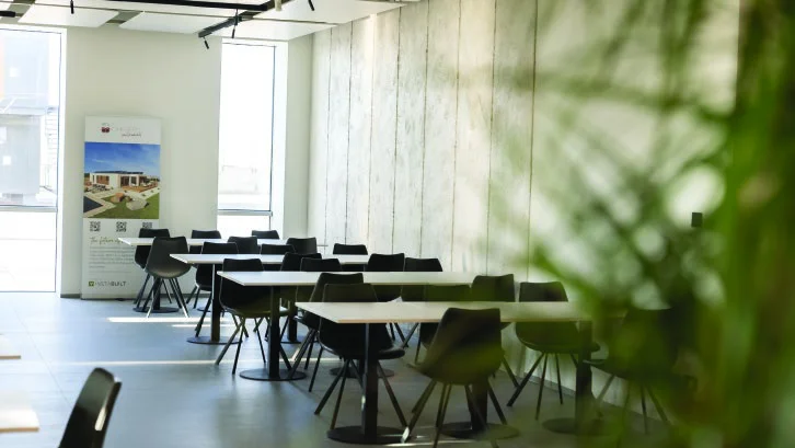 Informal tables and seating in a bright cafe-style space