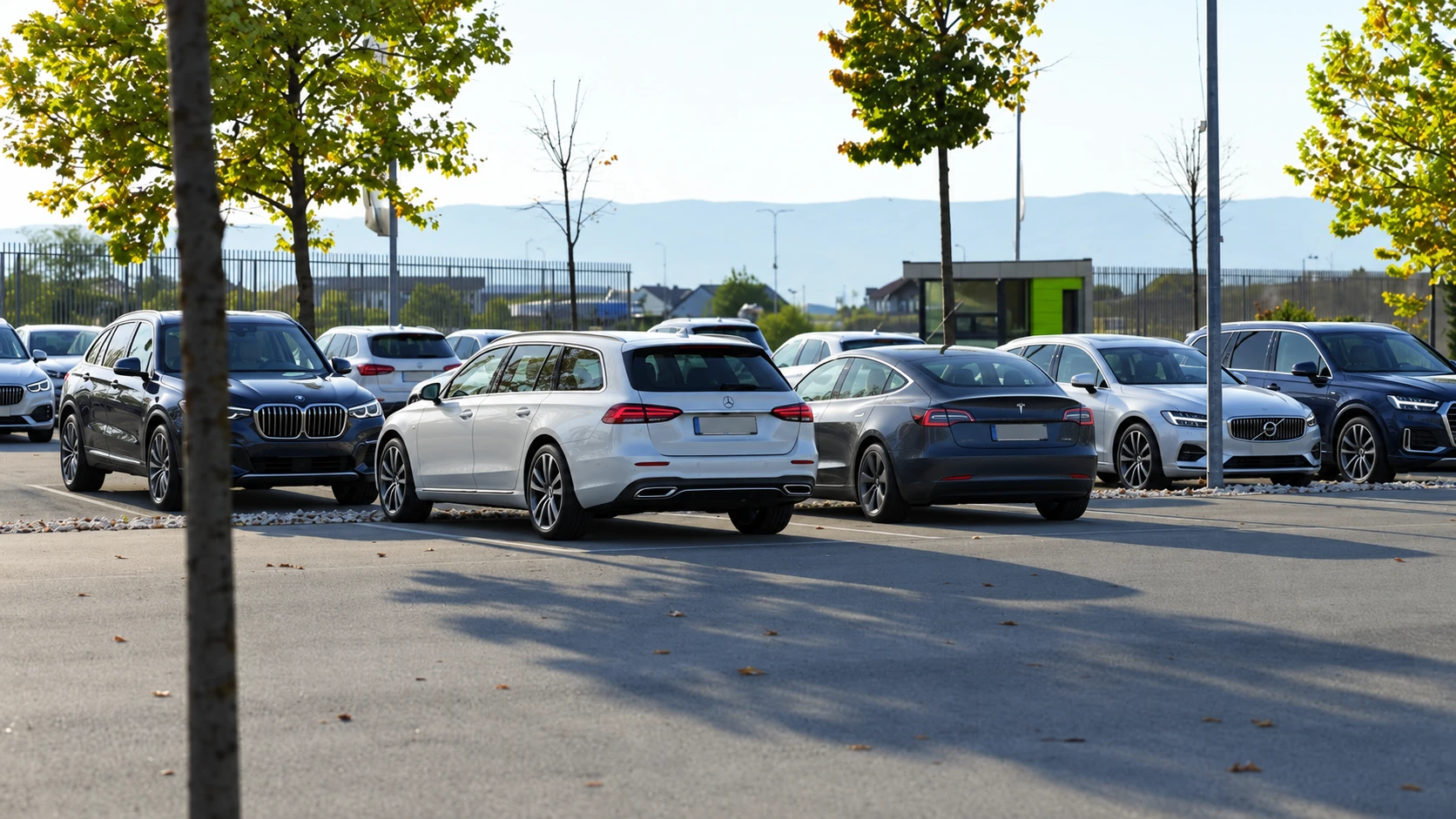 Illustrative parking view with AI-edited premium vehicles; setting based on the Business Park catalogue