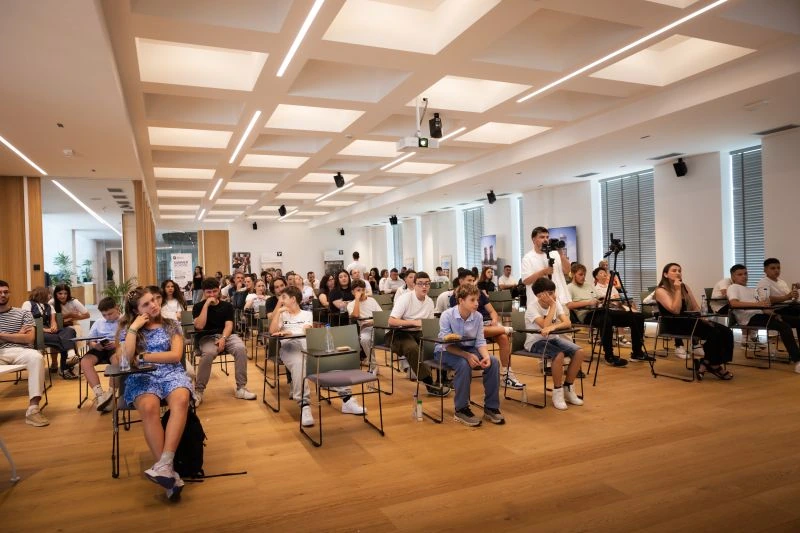 Participants attending Digital School project presentations at the Center